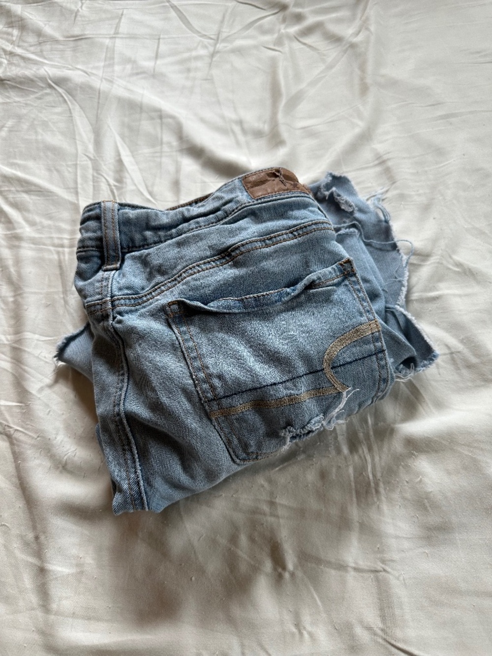 American Eagle Size 4 Light Wash Heavily Distressed Jeans
